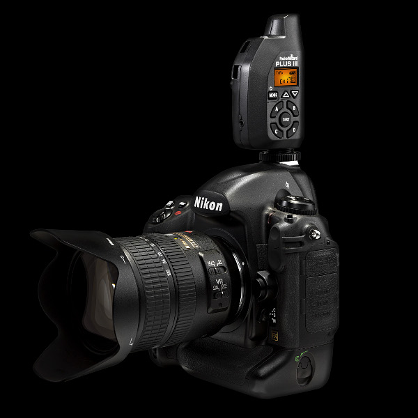 PocketWizard Plus III transceiver: on a Nikon camera, front angle view