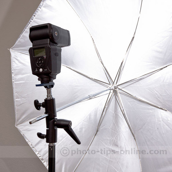 LumoPro LP180 flash: hot shoe mounted onto umbrella swivel adapter